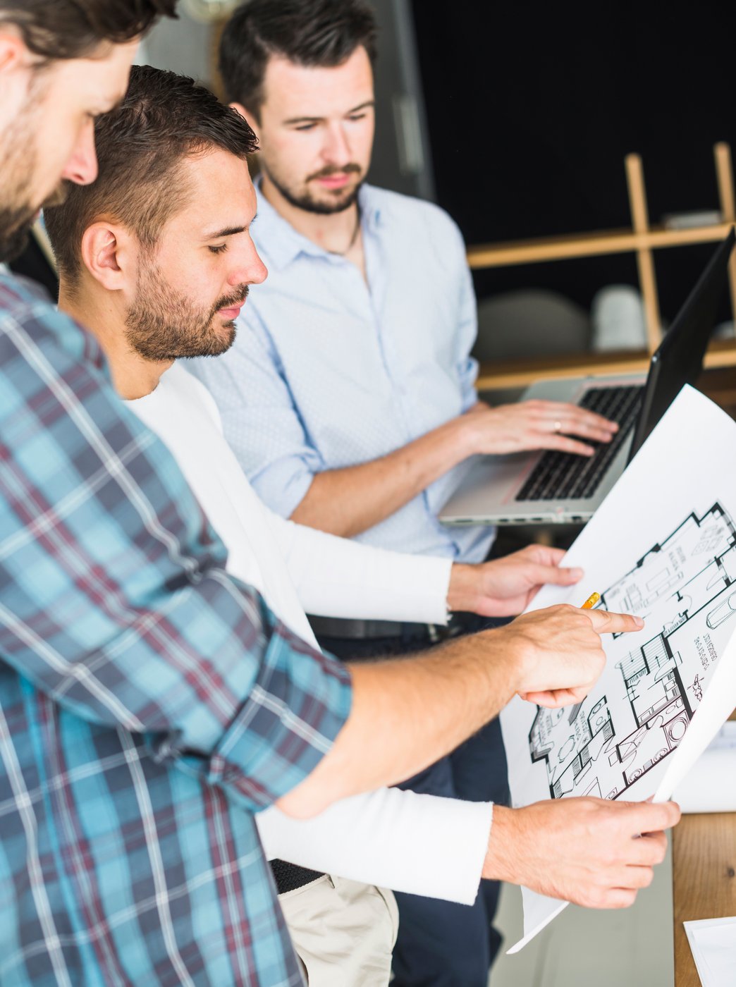 A pair of deliverymen putting parcels on a cart
