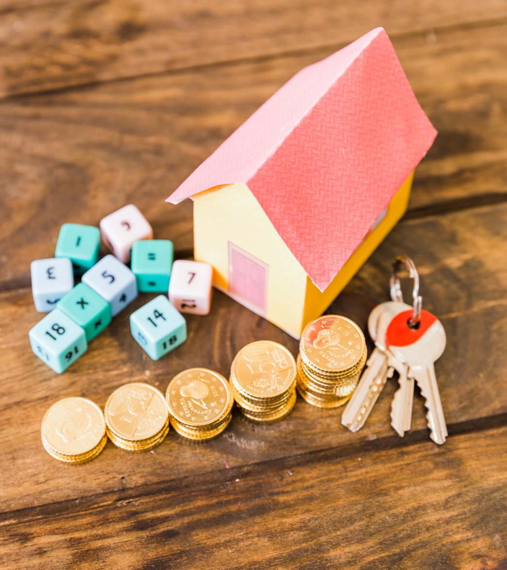 a car on a pile of money and insurance documents
